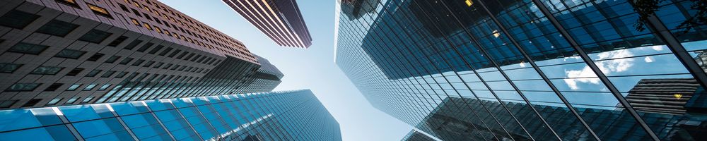 View looking up at tall office towers 