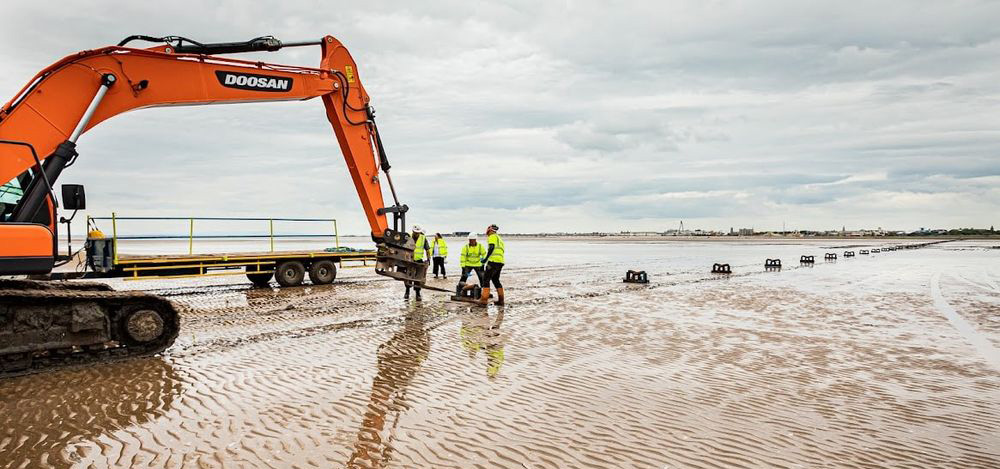 Shore-end work for euNetworks’ Rockabill subsea network, Southport Beach, United Kingdom. Image by euNetworks.